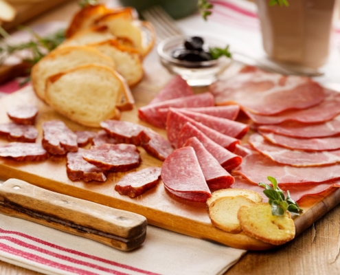 Close up of meats on a charcuterie board