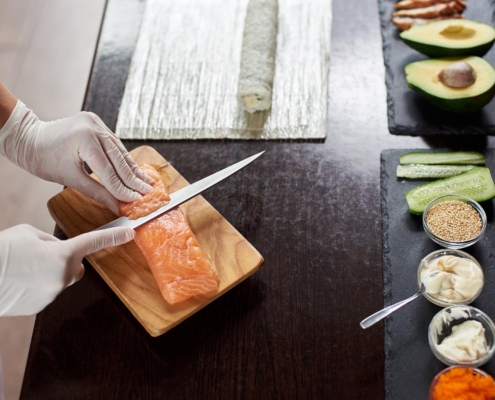 Chef cutting sushi