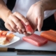 Sushi chef making nigiri sushi